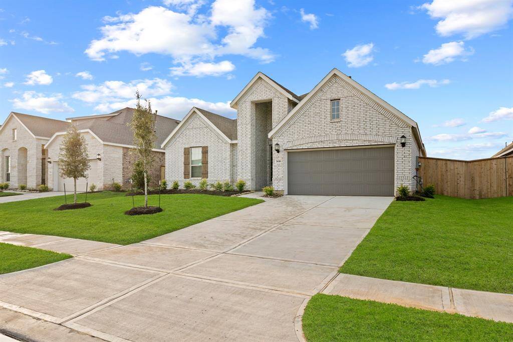 Beautiful home features fabulous Brick Front Elevation upon arrival with an inviting covered entry and extended driveway.