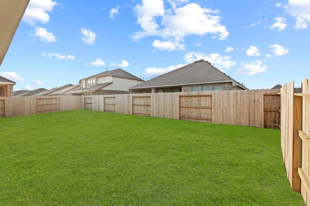 View of the Beautiful Backyard and space it has to offer for the kids or pets to play.