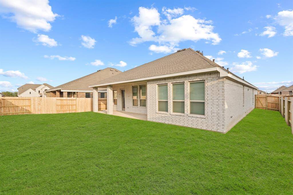 This huge backyard has enough space for a playscape or to host gatherings, call today!