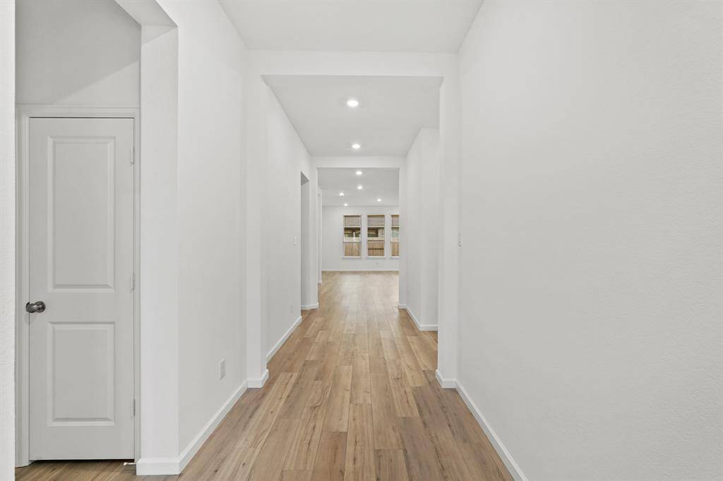 Upon entry handsome wood flooring greets you with high ceilings, recessed lighting and views to the additional living spaces.