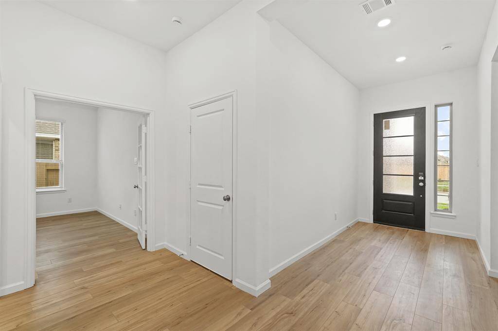 Formal Foyer offers a Custom Door with frosted glass for additional privacy, access to secondary bedrooms and Sophisticated Study as well.