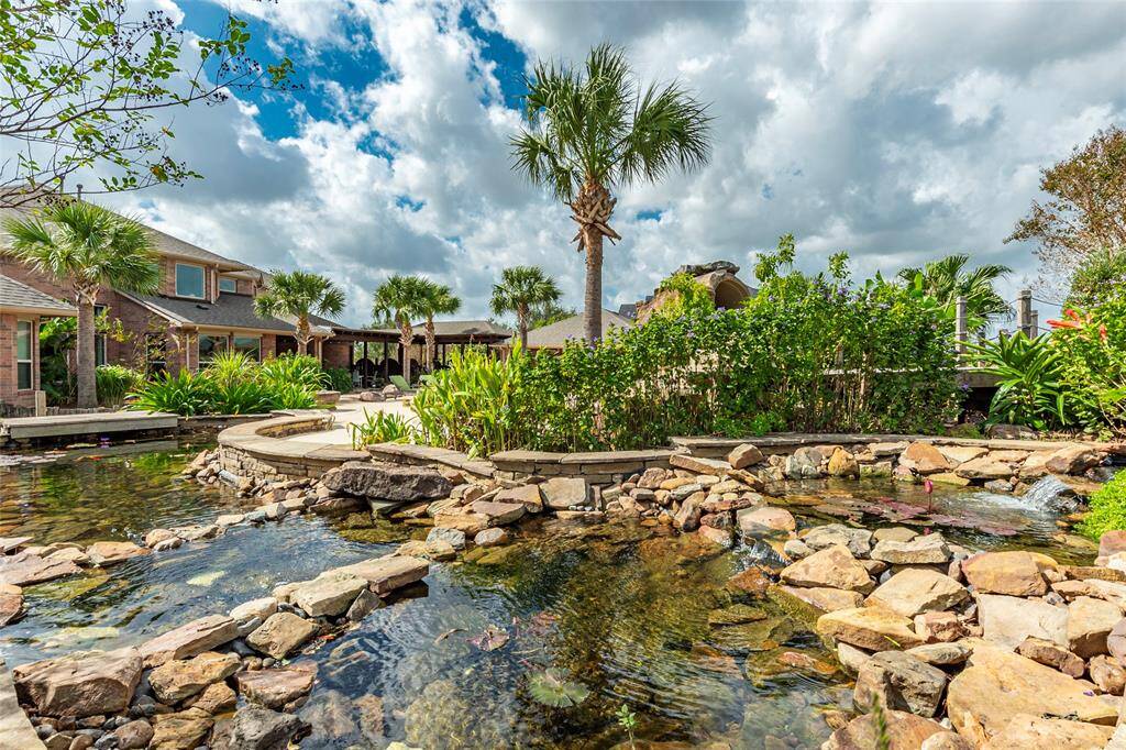 Serene Sanctuary! For those who cherish nature, this home is a haven for wildlife. The professionally installed Koi pond with easy care and maintenance, complete the serene outdoor experience.