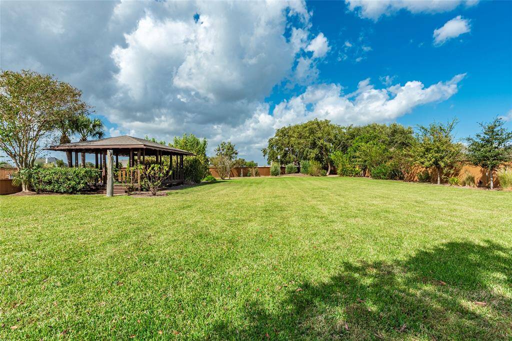 Entertaining and Comfort Redefined!  Nestled in the heart of the 1.65-acre lot is an expansive exterior detached pavilion offering the perfect private setting for outdoor parties and gatherings.