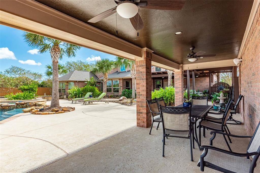 Keep the Party Going! Endless space for family and friends under the extended second covered patio—ideally positioned poolside for shaded lounging and seamless entertaining—complemented by a private pool bath and outdoor shower.