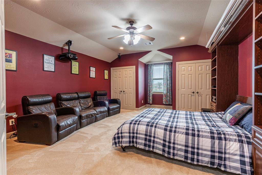 The built-in custom Murphy bed allows for a seamless transition from fully equipped media room to cozy bedroom, delivering the ideal mix of comfort, entertainment, and guest-friendly flexibility.