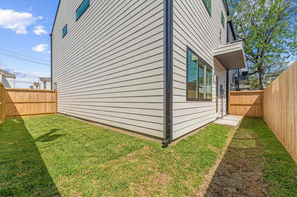 Exterior: Backyard, elevated A/C, and CLIMATE CONTROLLED STORAGE ROOM!