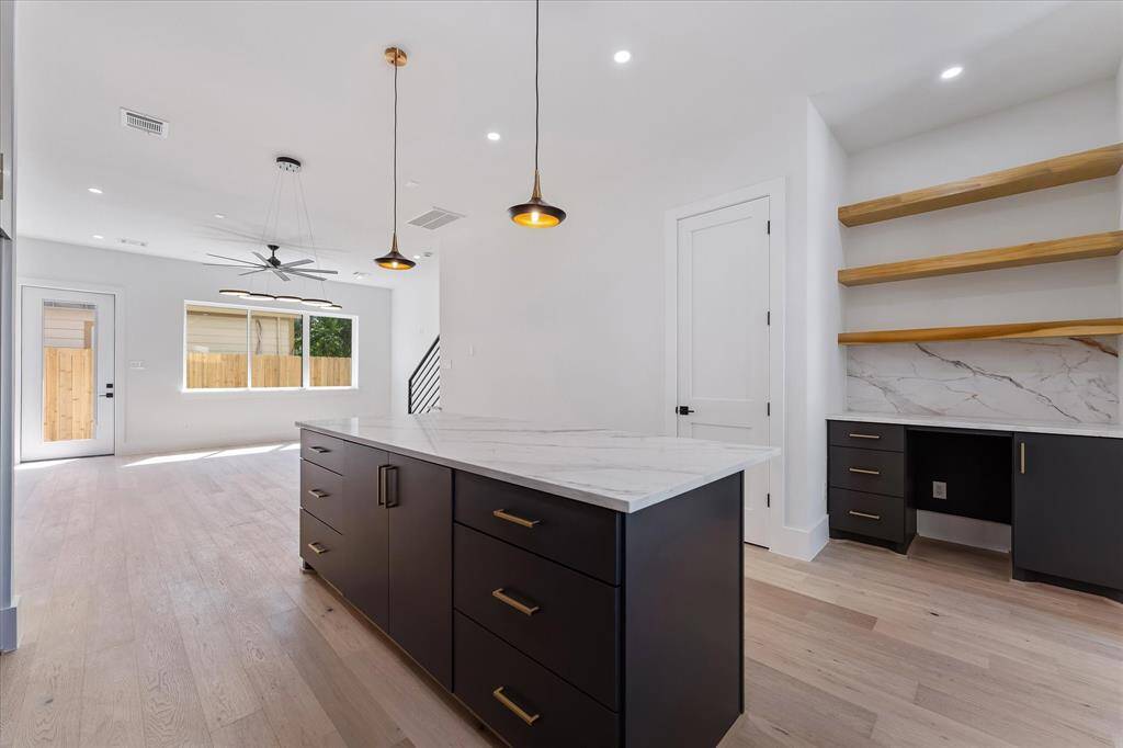 View from the kitchen to the dining and living areas.