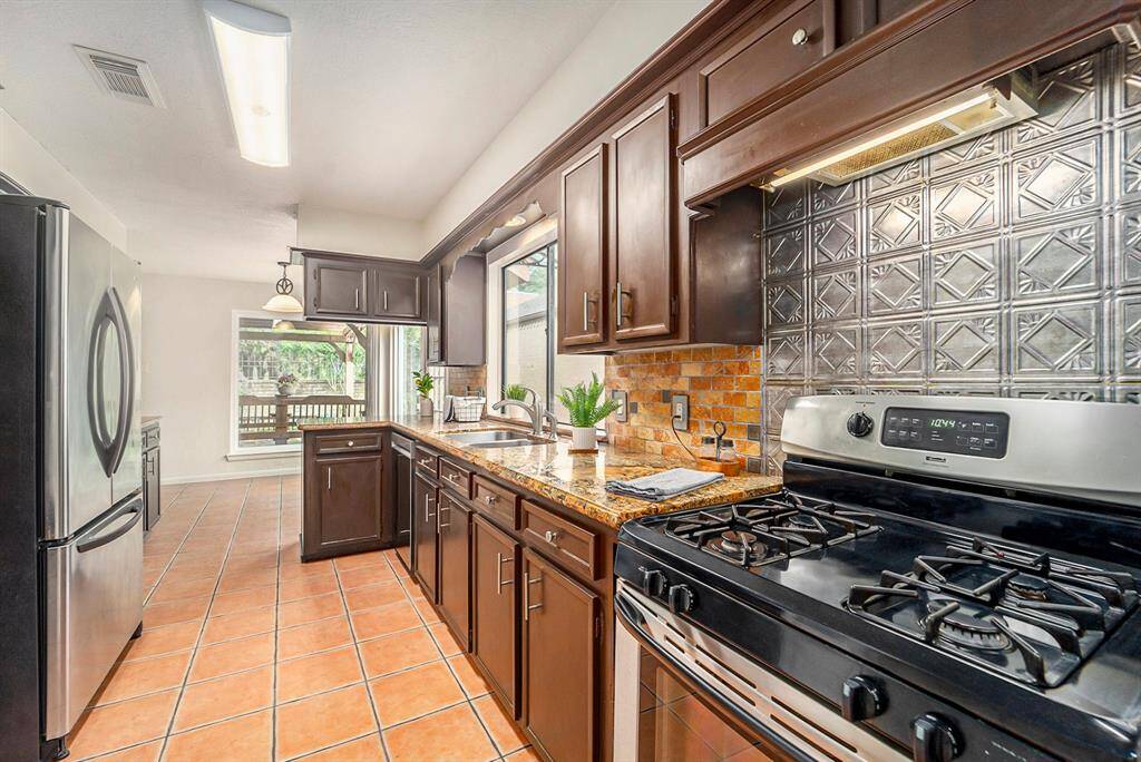 Whether you love to cook or just need space to spread out, this kitchen has you covered- with ample surface area and natural light to keep it feeling open and functional.