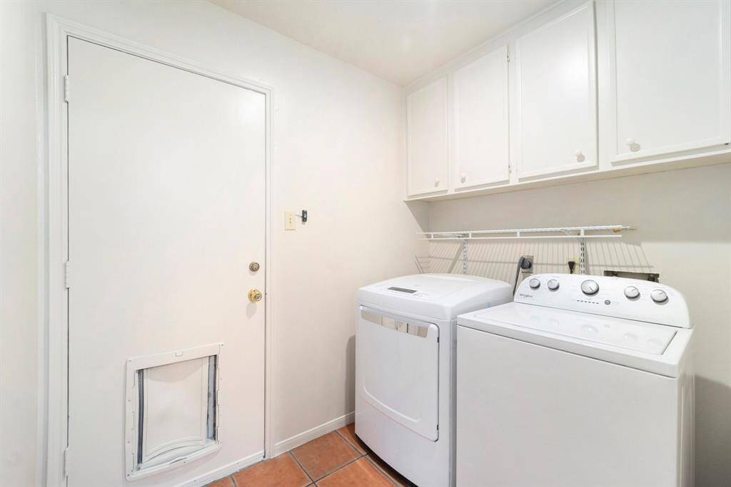 There's easy access to the attached garage entrance, making it super handy for bringing in groceries or heading out the door. The laundry room just off the garage entrance makes it a practical spot for dropping off muddy shoes or tossing in a quick load.  Including extra cabinet space for more storage.
