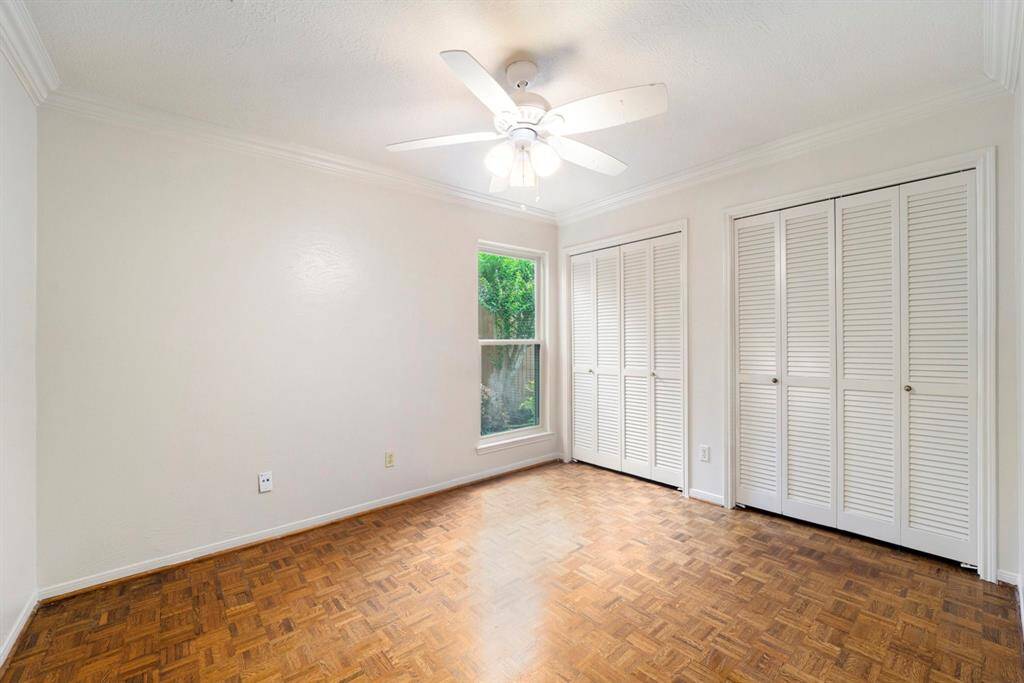 One of two secondary bedrooms is comfortably sized with good closet space and a window that brings in lots of natural light. Whether you need guest room, a home office, or space for family, this room offers flexibility and comfort.