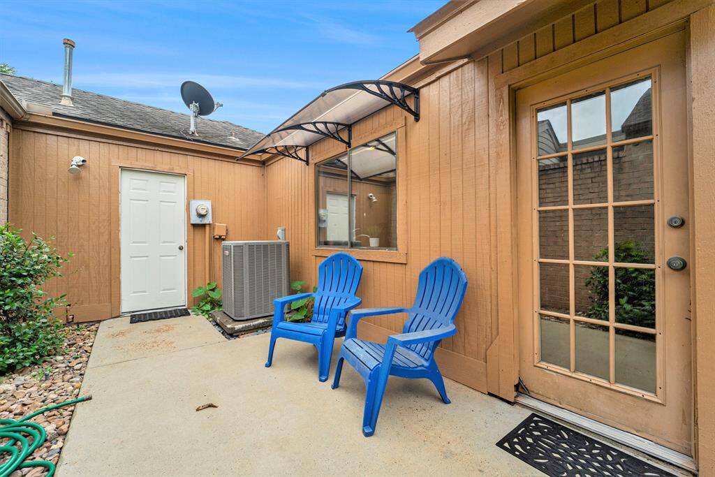 There's a cozy outdoor sitting area that's perfect for relaxing and enjoying a quiet moment. A door from the breakfast room opens right to this space, making it easy to step out to.