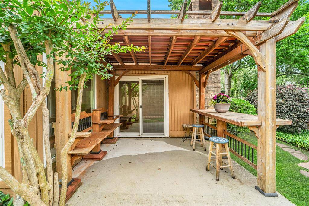 This charming, covered patio is not just an extension of the home; it's a perfect outdoor oasis that enhances the overall appeal of the property. It offers a perfect retreat for outdoor living.