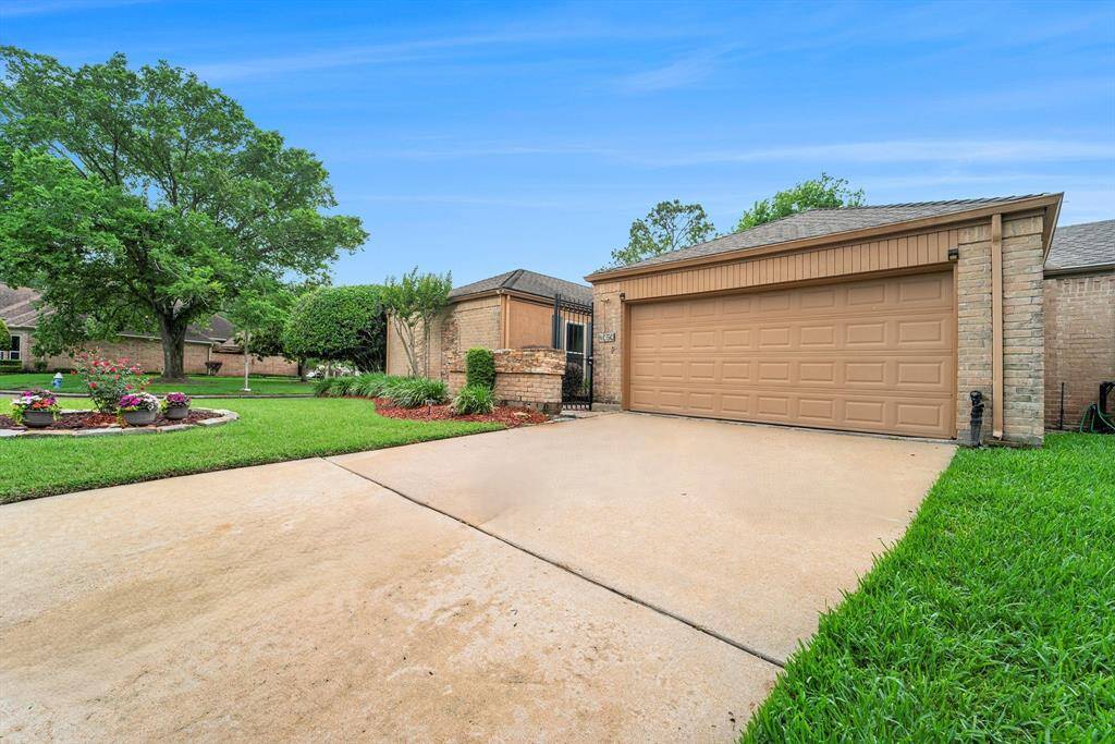 The two-car attached garage offers plenty of space for parking and storage.