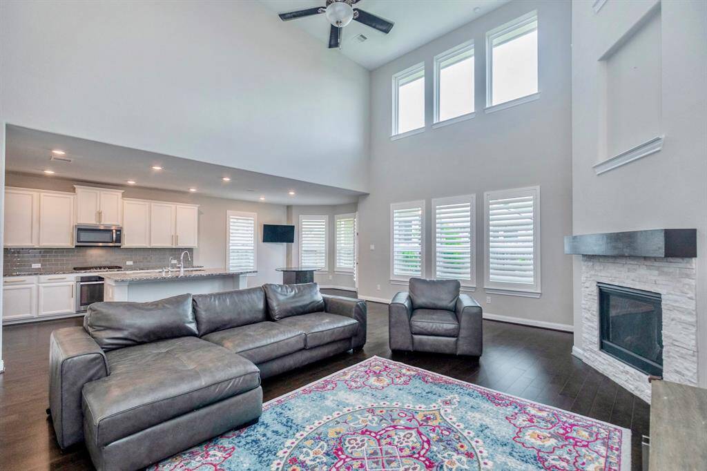 THE FAMILY ROOM IS OPEN TO THE KITCHEN AND FEATURES A DRAMATIC FIREPLACE!