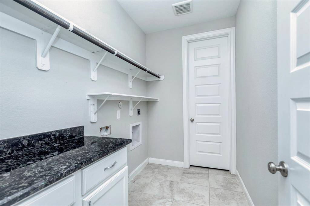LAUNDRY ROOM WITH GRANITE COUNTER SPACE