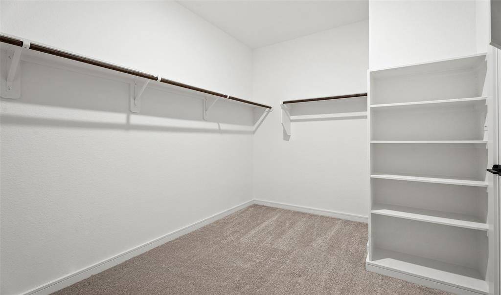 Walk-in closet in primary suite (*Photo not of actual home and used for illustration purposes only.)