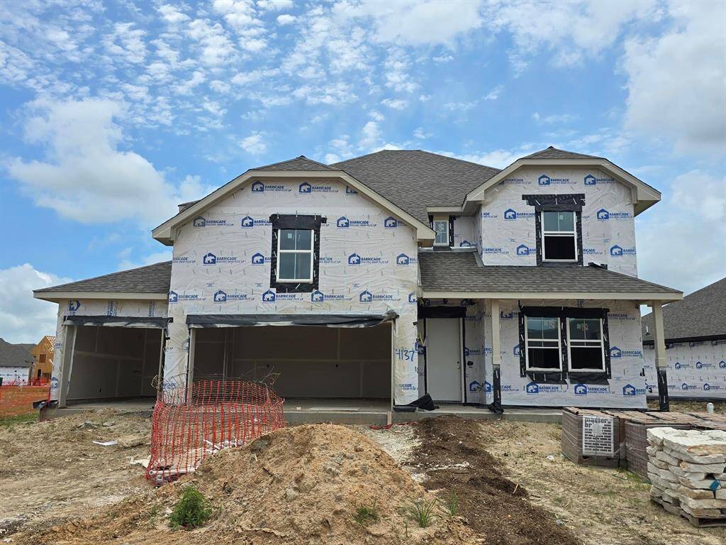Two story home with 4 bedrooms, 3.5 baths, and 3 car garage.