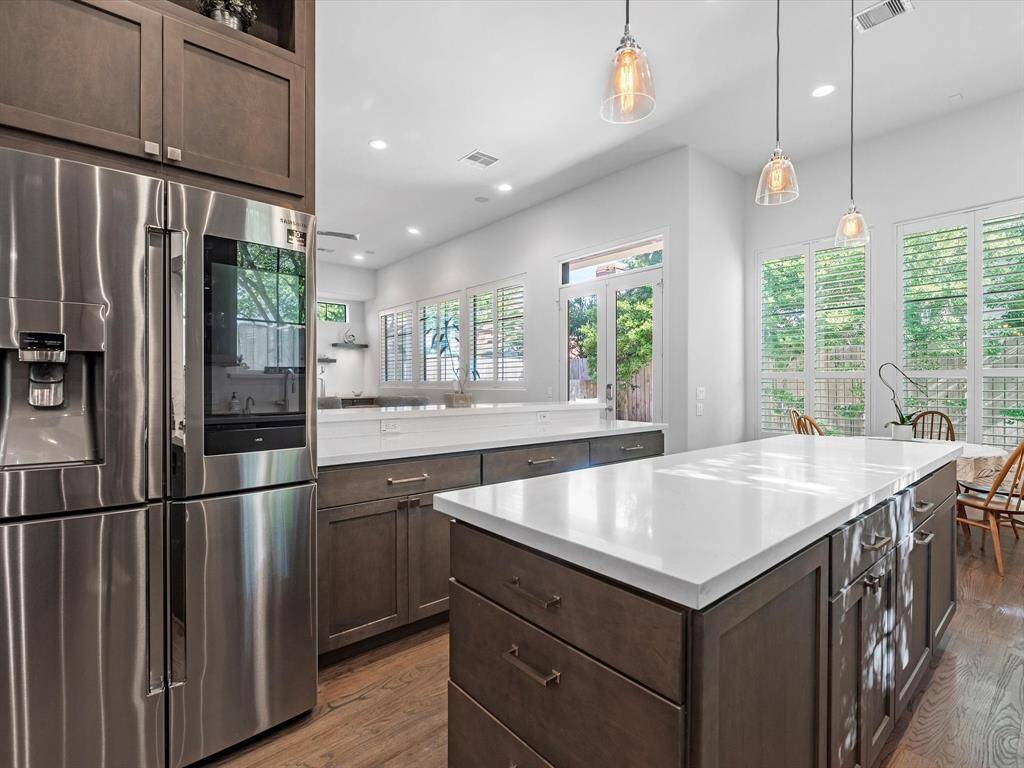 This kitchen pairs sophisticated design with smart functionality. From the oversized island with seating to the soft-close drawers and abundant storage, every detail is thoughtfully designed for beauty and use