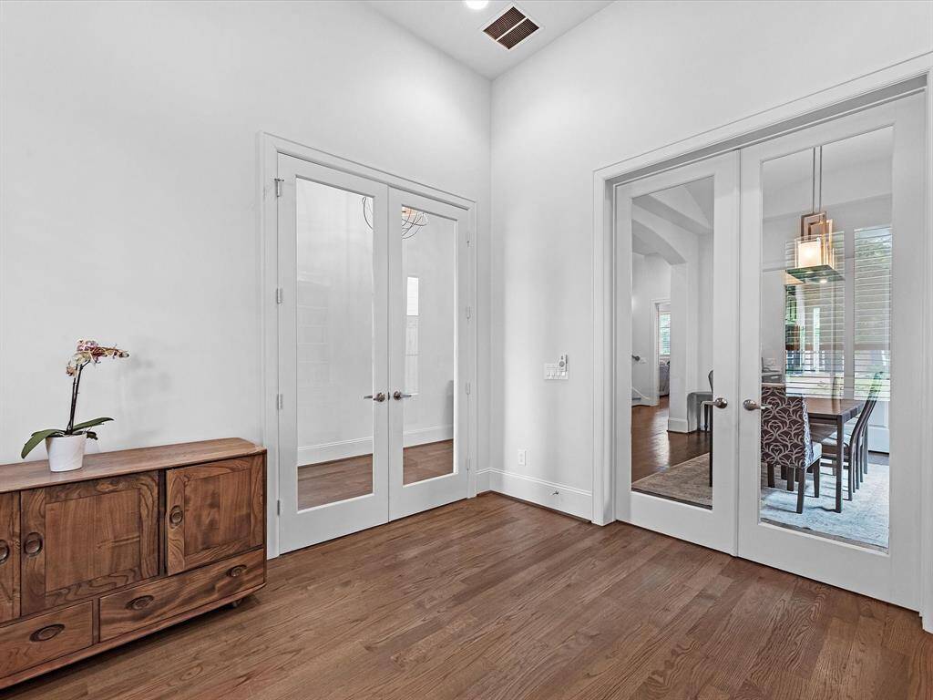 The office is serviced by 2 sets of glass doors, bringing additional light in.
