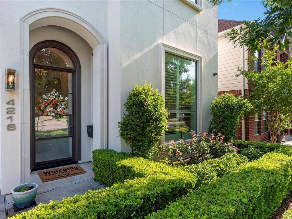 Charming front door sets the tone for this inviting home, combining style and security.
