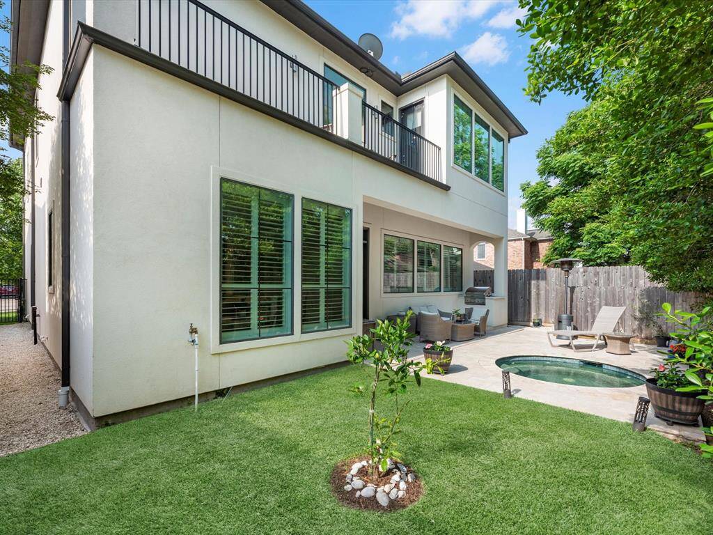 The rear yard, with 8-foot fences, is like an intimate sanctuary - offering privacy and a space to relax.
