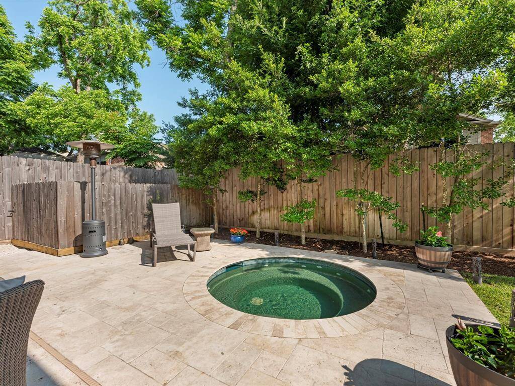 The in ground hot tub represents the perfect place to unwind.