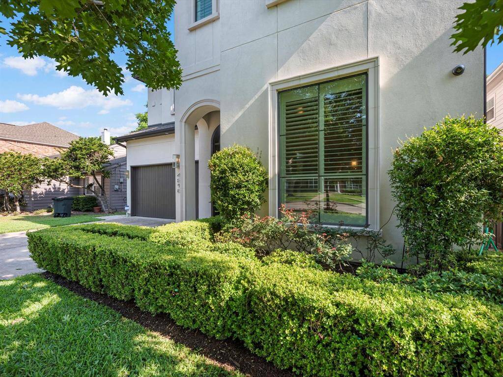 Charming curb appeal with a beautifully manicured front yard.