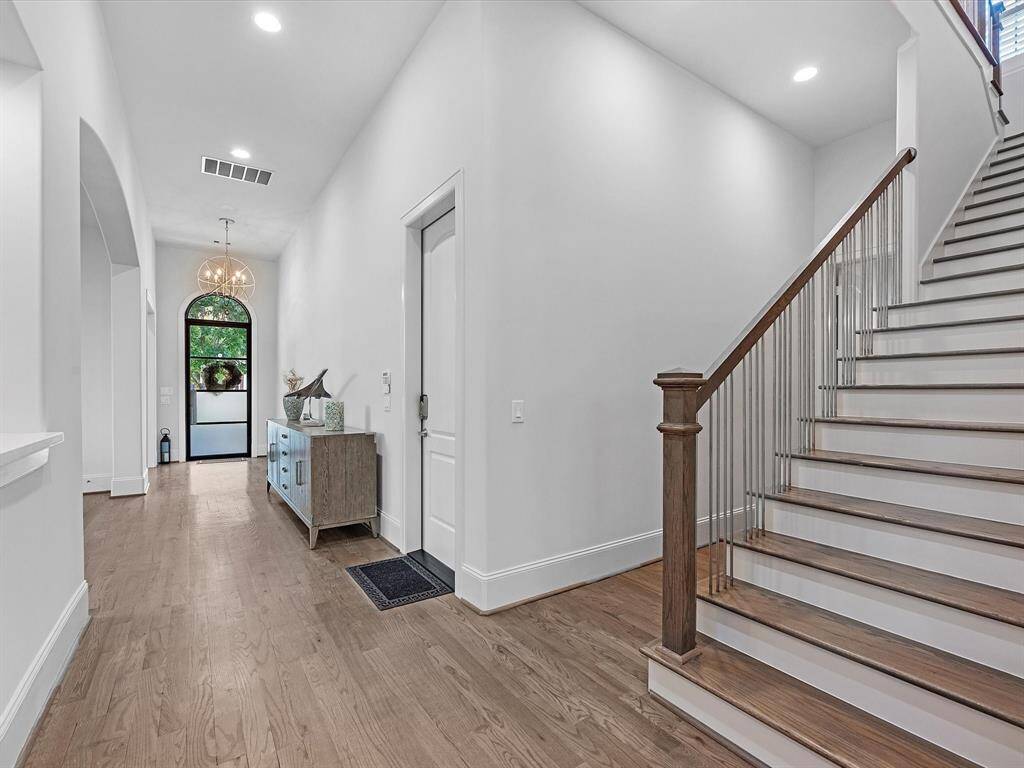 Beautiful oak flooring enhances the inviting ambiance of the first floor, setting the stage for both everyday living and entertaining.