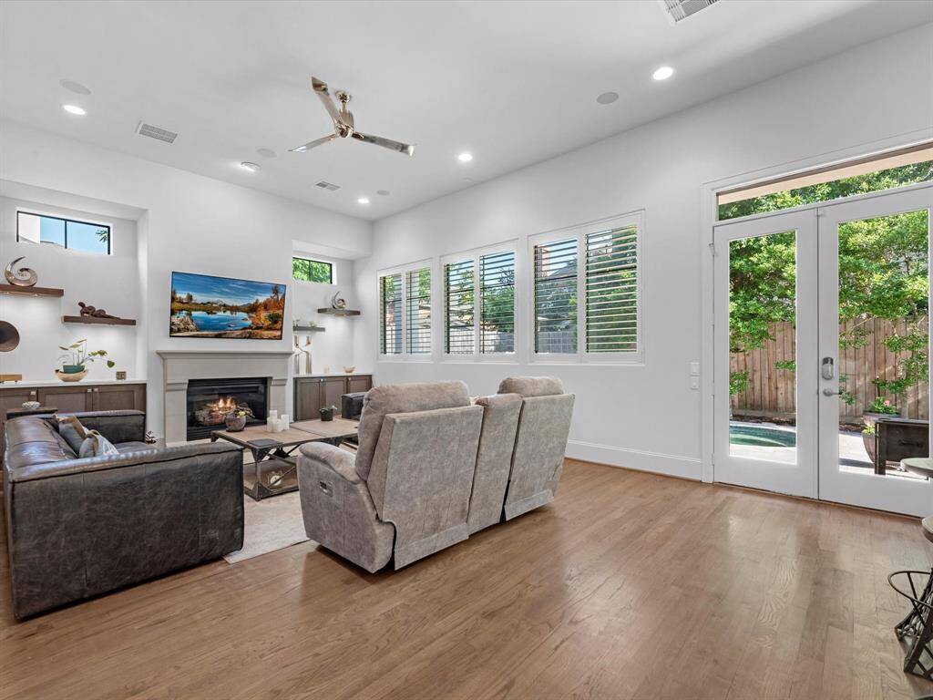 The expansive living room boasts impressive high ceilings, offering a sleek, contemporary feel ideal for both relaxation and entertaining.