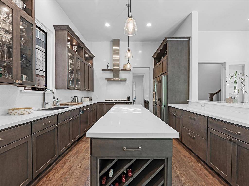 Crafted for the modern home chef, the kitchen offers expansive work surfaces and premium Silestone counters, blending form and function effortlessly.