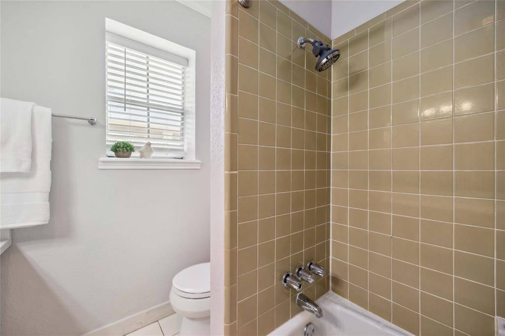 The primary bath includes a tub and shower combination.
