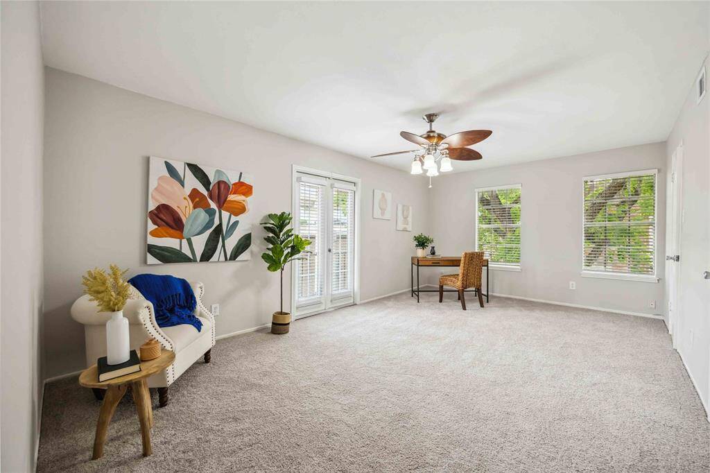 The secondary bedroom and en suite bath include access to the balcony.