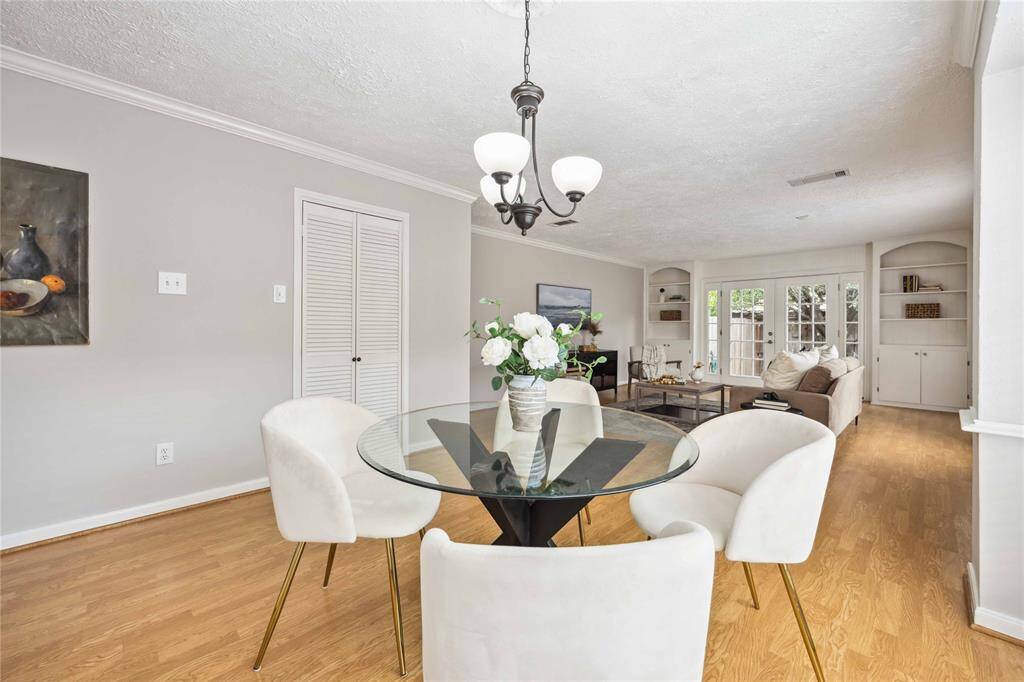 The formal dining room shares a large open space with the living room, creating an ideal space to entertain.