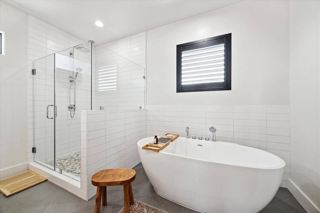 Stand-alone soaking tub, and separate shower.