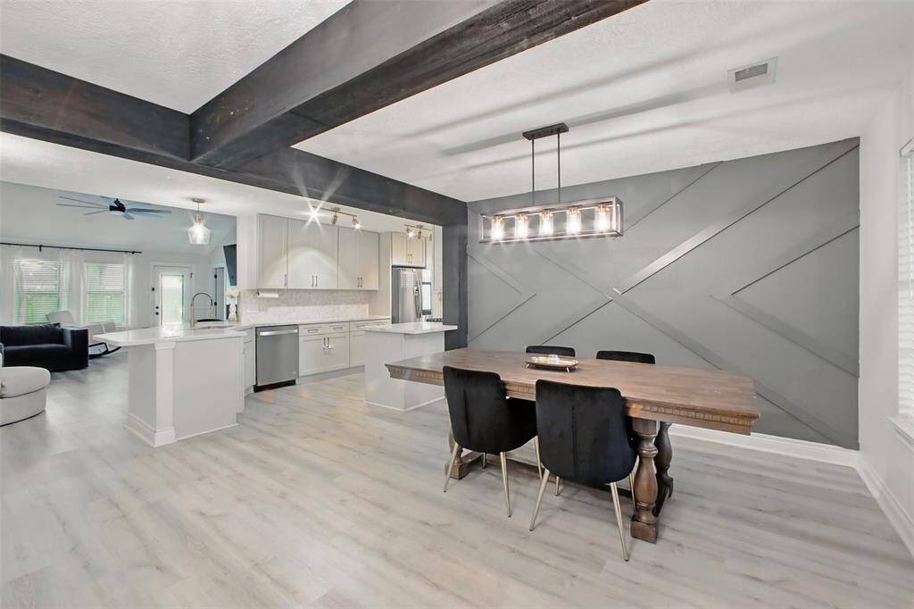 Dining Area with Accent Wall & Updated Light Fixture
