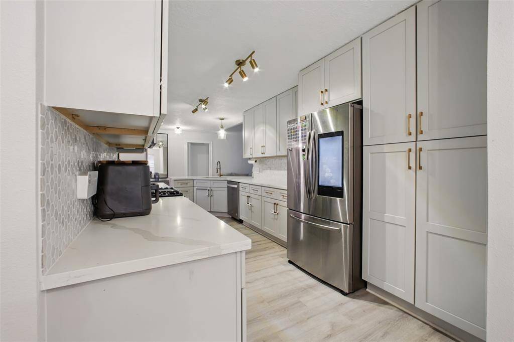 Modern Cabinetry & Lighting (Fridge is excluded)