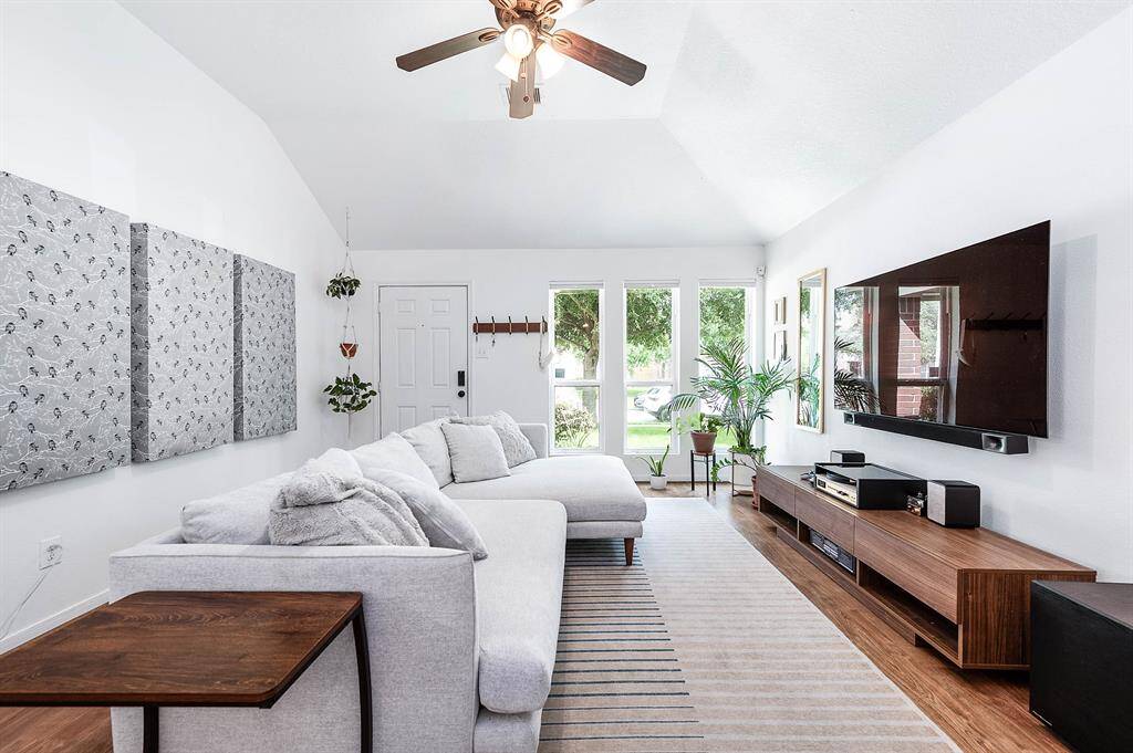 Living Room With High Ceilings & Natural Light.
