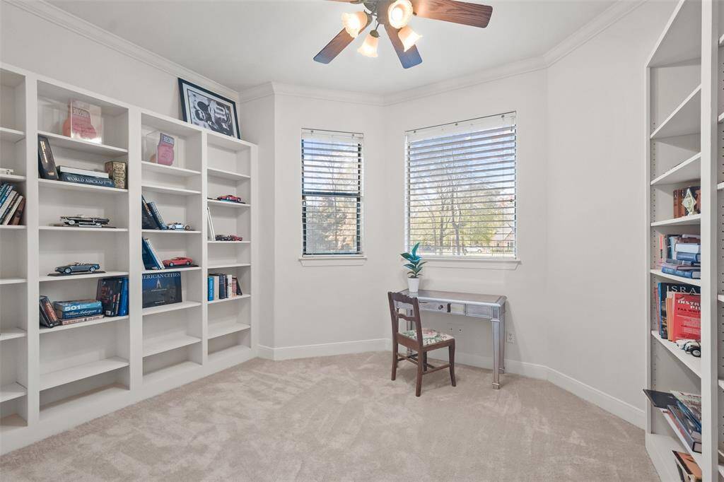 Private home office with walls of built-ins.