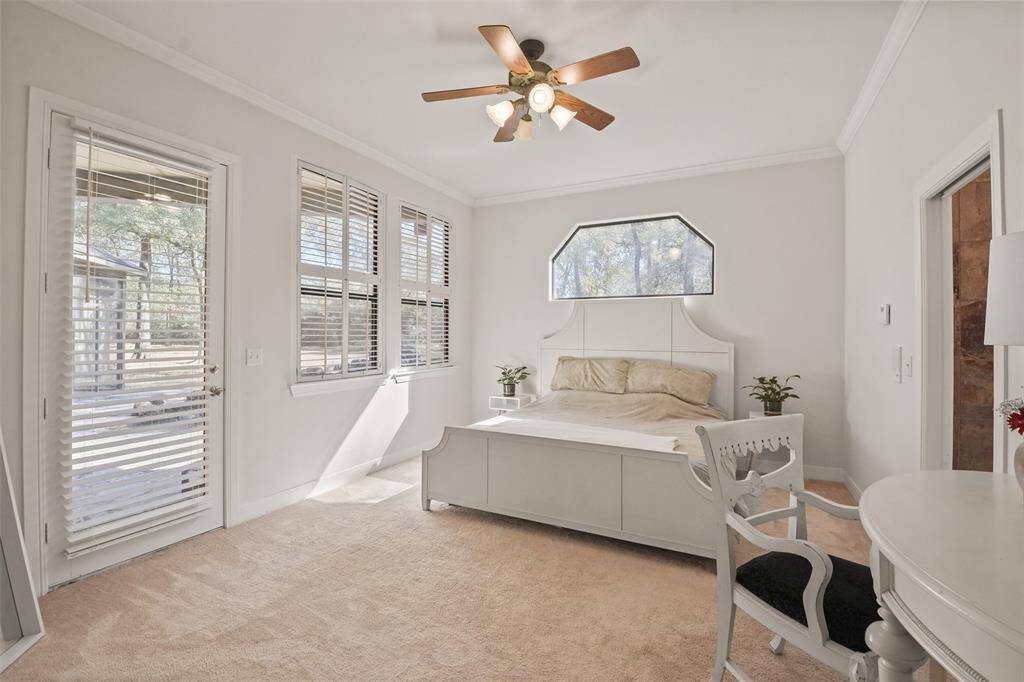 The primary suite features abundant natural light & direct access to the backyard.