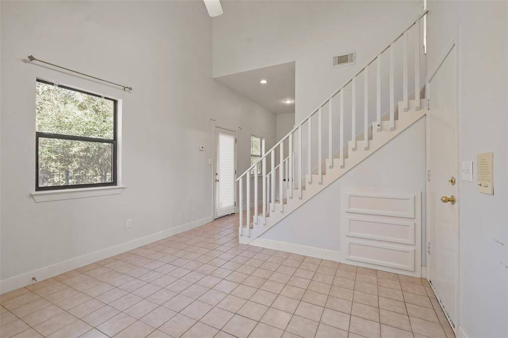 Guest quarters with a kitchenette & full bath can be accessed from the garage or the upstairs gameroom.