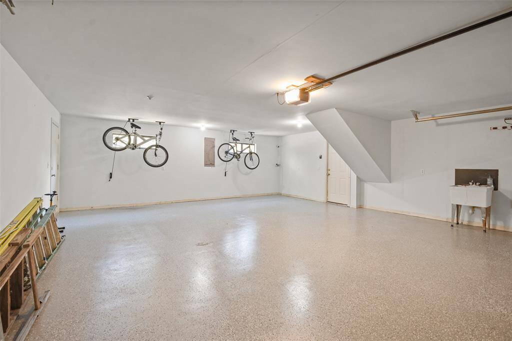 Four car garage with epoxy coated flooring.