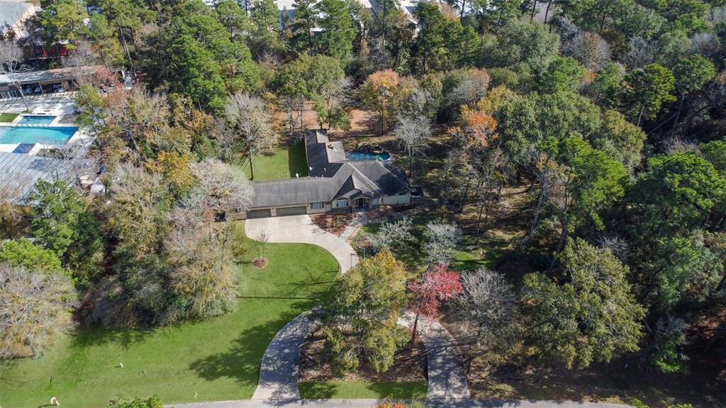 The home is surrounded by trees creating a private, tranquil setting.