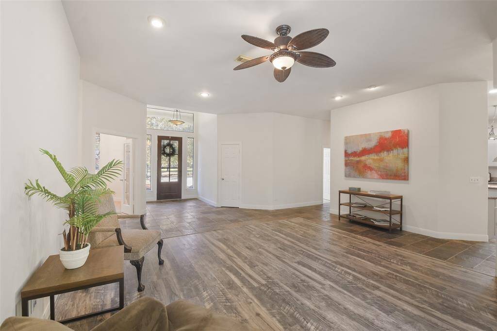 Another view of the living room. High ceilings & recessed lighting are found throughout much of the home.