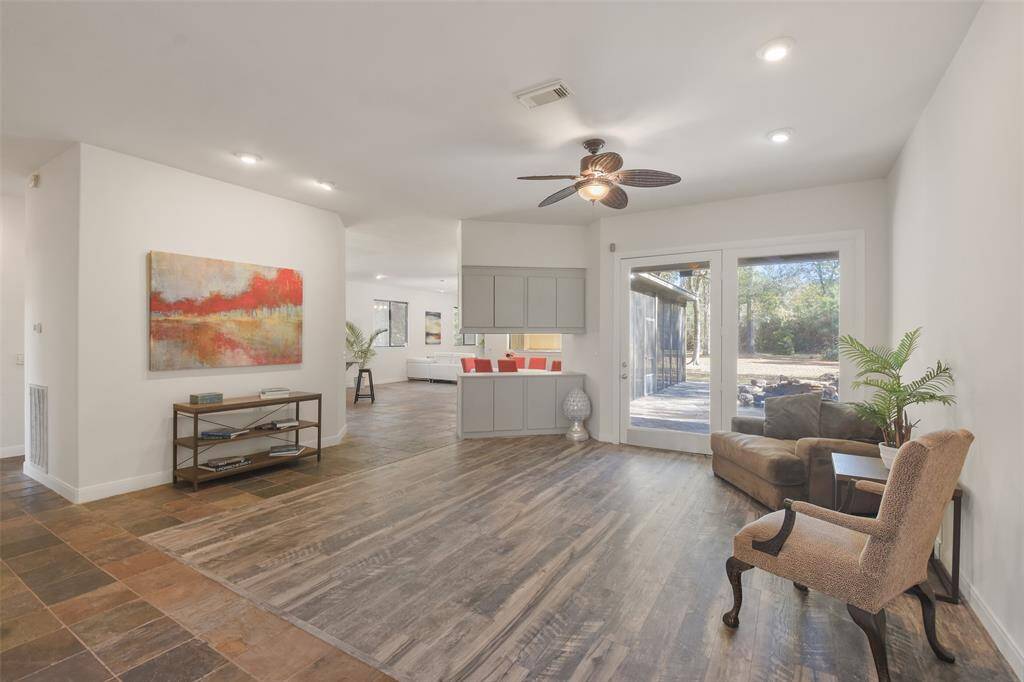 Upon entering is the formal living room. This is a bright & open space that overlooks the backyard.