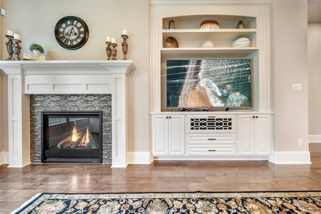 Family room features a gas log fireplace and built in cabinetry for your TV and accessories.  A very thoughtful design element.