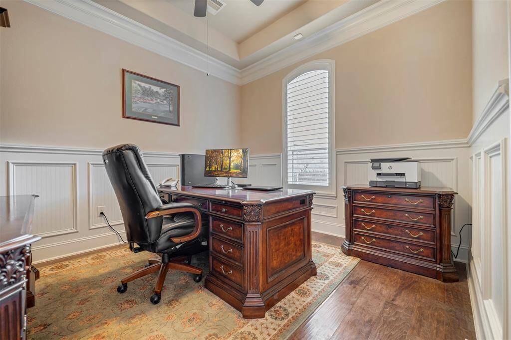 Handsome home office is in the front of the house, off the beaten path so you can freely take those business calls without interruption.