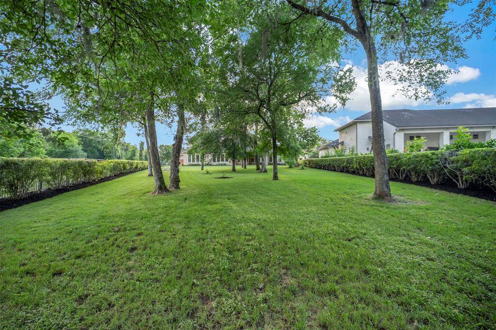 This PRIME Lot features mature trees, and a few fruit trees and raised vegetable garden.  Being on the end of the cul de sac, you only have one side neighbor which equates to a peaceful sanctuary for your family.