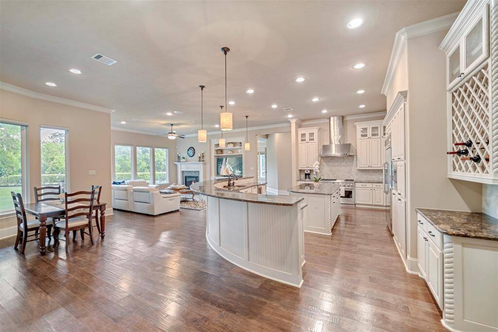 This is truly the HEART of the HOME as the kitchen, breakfast area and family room flow seamlessly from the dining room through to the game and media rooms.  ALL with stunning windows allowing views of the park-like backyard! Incredible design.