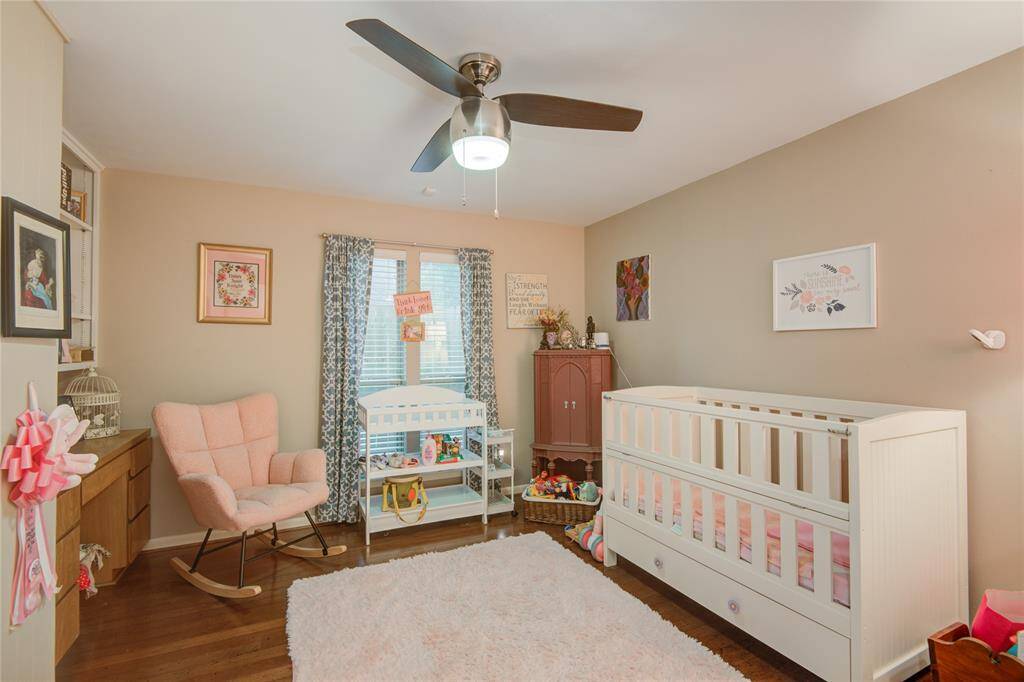 One of the secondary bedrooms is currently set up as a charming nursery, offering a cozy and peaceful space.