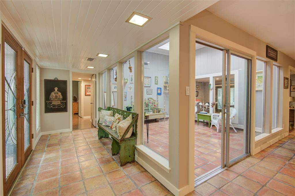 Step into the bright foyer with views of a central air-conditioned atrium featuring skylights and walls of windows.